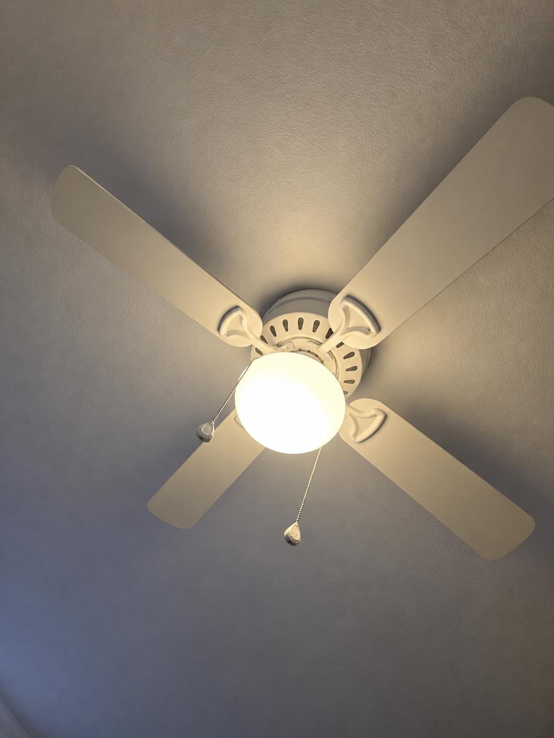 White ceiling fan wiped clean
